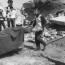 A Palestinian woman cries while civil defense workers carry the body of one of her relatives away from the rubble of her home in the Palestinian refugee camp of Sabra, in West Beirut 19 September 1982. Hundreds of Palestinians were killed in Sabra and Shatila, the two biggest camps in Lebanon. (Photo credit should read STF/AFP/Getty Images)